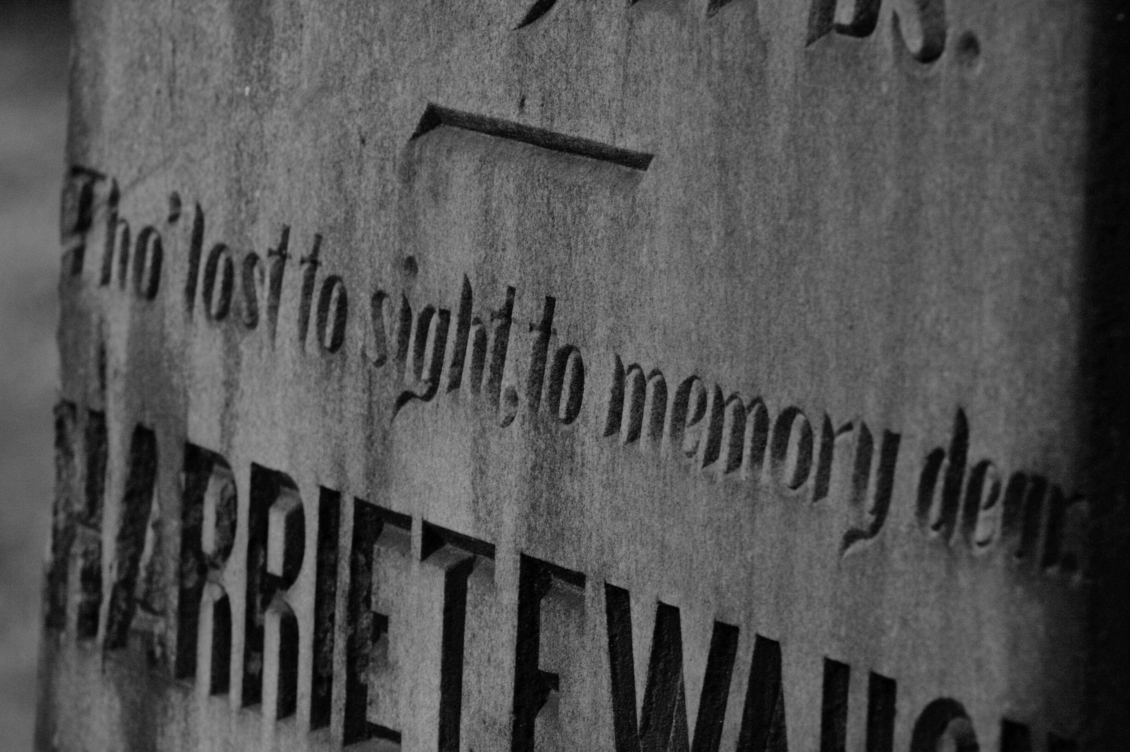 black and white photo of a grave stone with the inscription "Tho' lost to sight, to memory dear  HARRIET..." then inscription is cut off